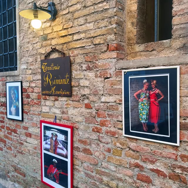 Insegna storica della Trattoria Rimante su muro in mattoni